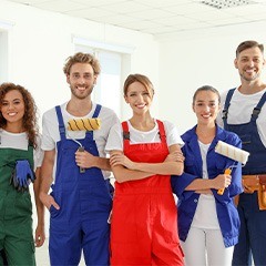 A team of professional painters smiling