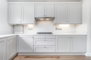 a kitchen with white cabinets